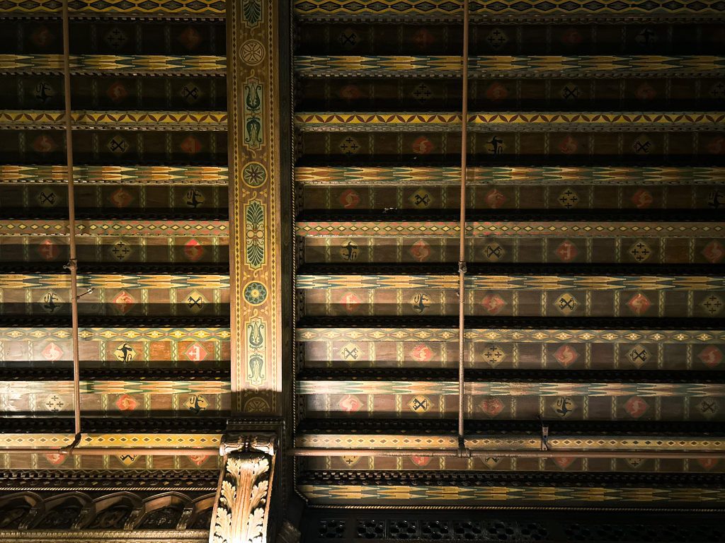 Manually straightened Photograph of the board and batten ceiling in the NYC bar The Campbell.