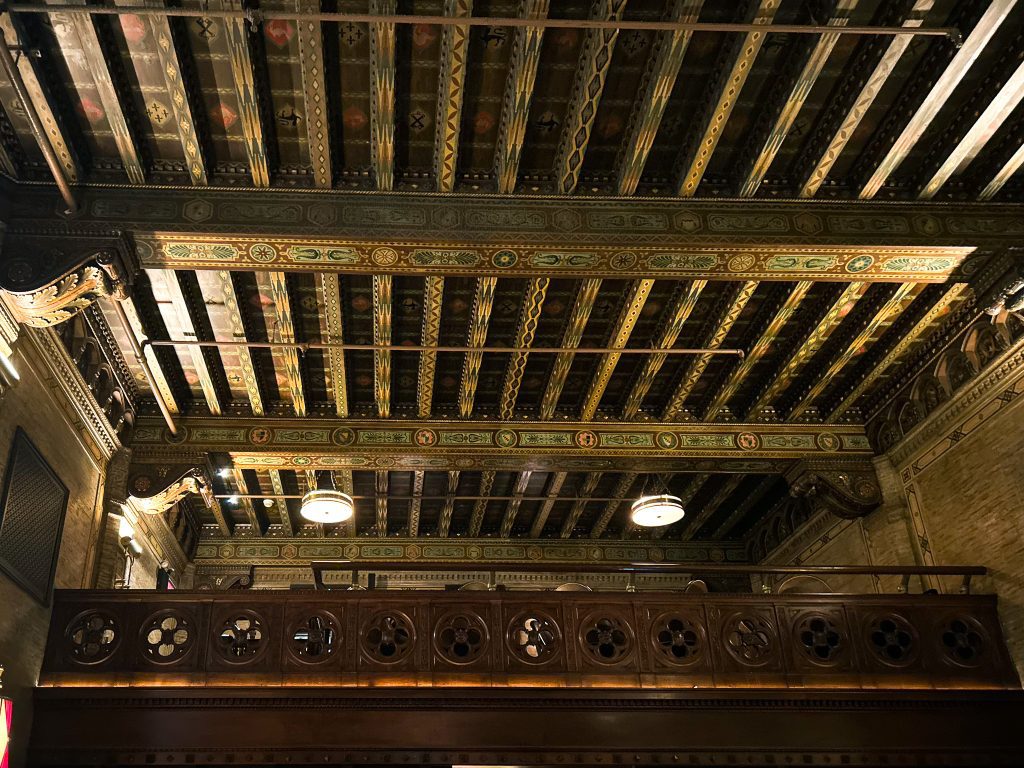 Manually straightened Photograph of the loft seating and ceiling in the NYC bar The Campbell.