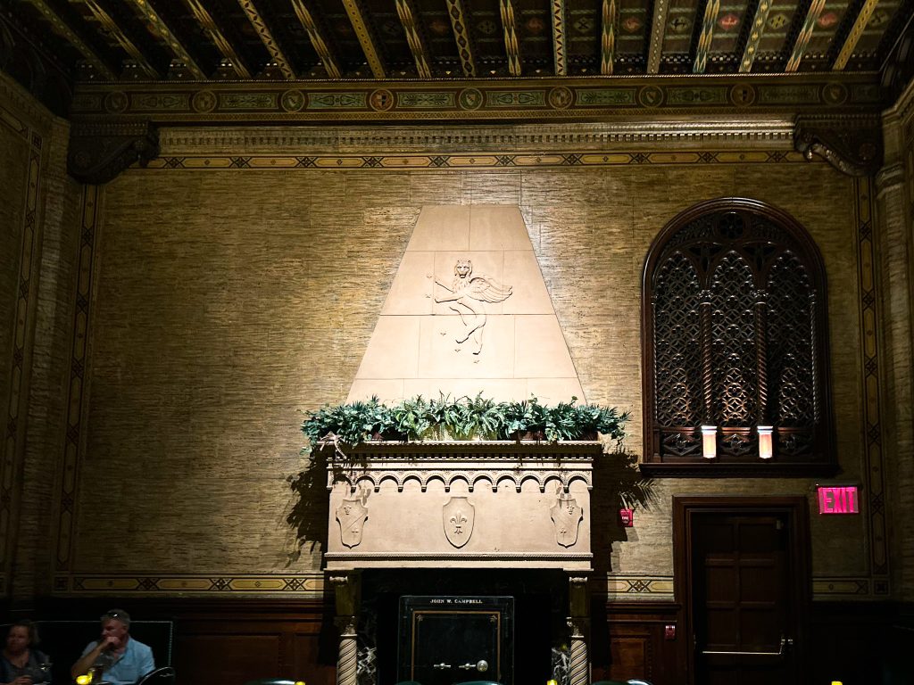 Manually straightened Photograph of the fireplace in the NYC bar The Campbell.