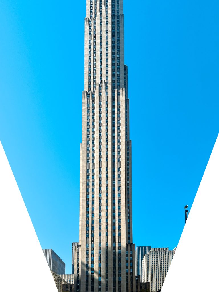 AI "straightened" Photograph of the Rockefeller Center taken from the ground, looking up.