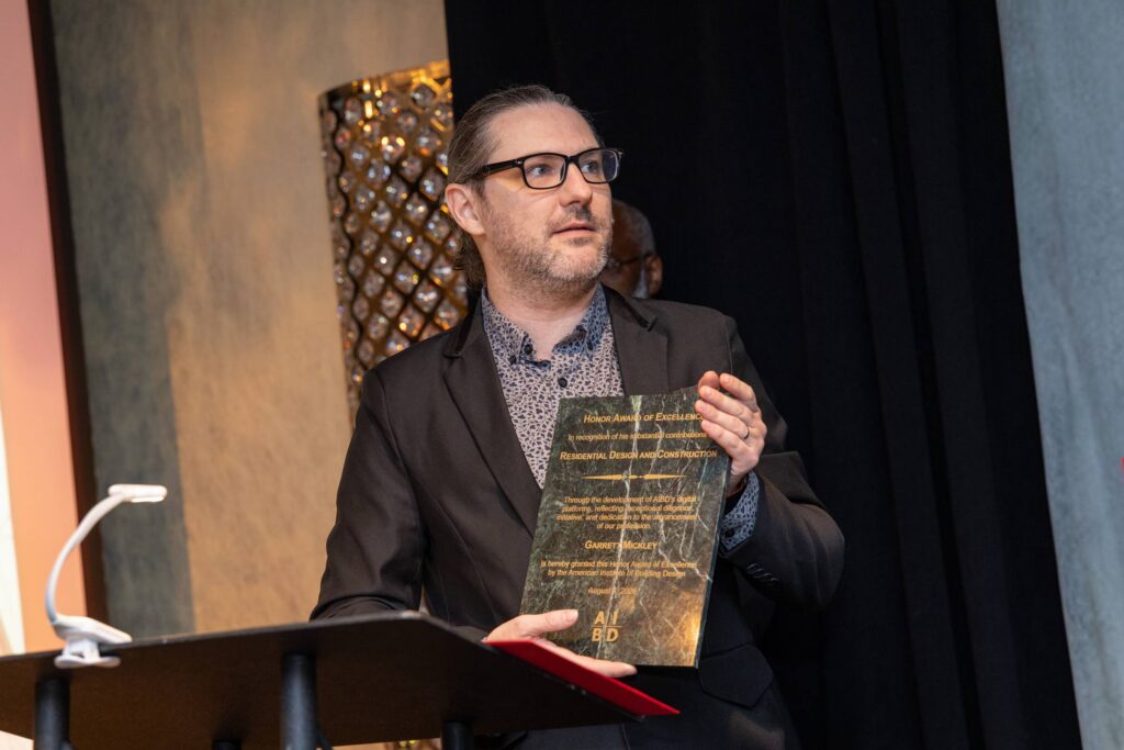 A white man being presented an award.